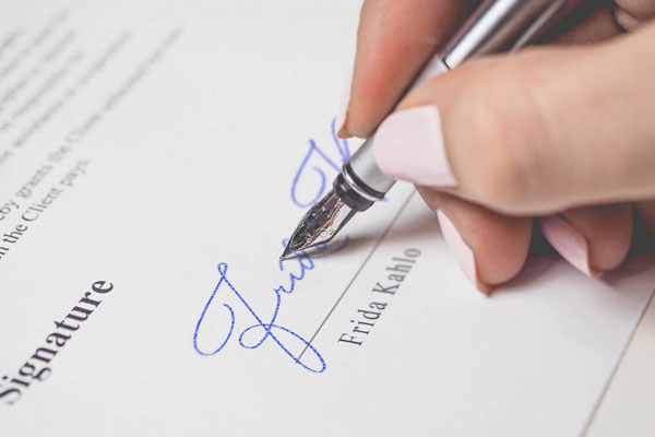 Signature Mockup of a Female Hand Holding a Fountain Pen FREE PSD
