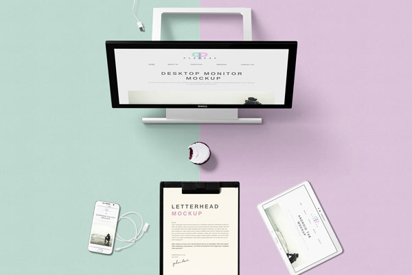 Top View of Desktop Monitor Mockup with Different Electronic Devices FREE PSD
