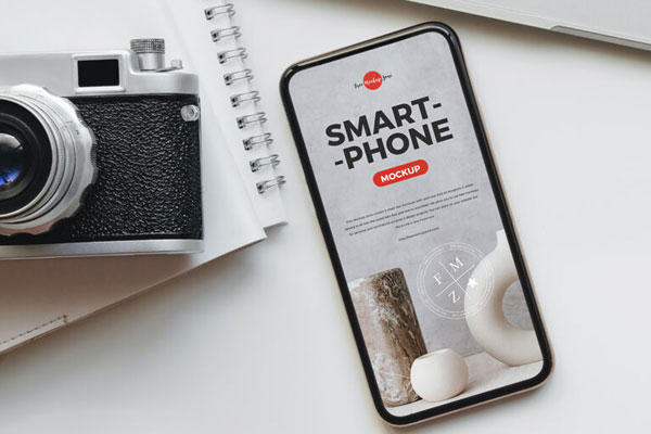 Top View Smartphone Screen on Desk with Camera and Laptop Mockup FREE PSD