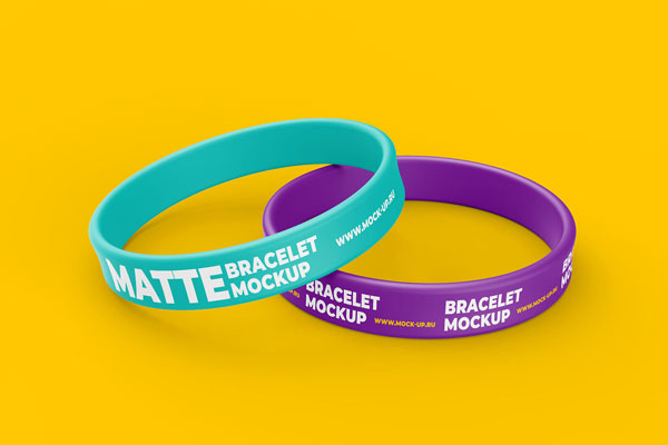 2 Mockups of Elastic Wristbands Placed on Surface at the 3\4 Angle View FREE PSD