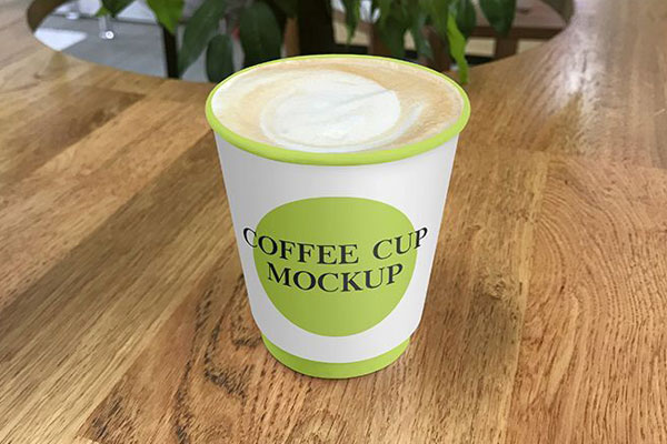 2 Mockups of Paper Coffee Cup On Café Table FREE PSD