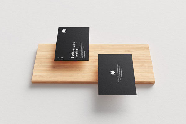 5 Mockups of Floating Business Cards Along with a Wooden Board FREE PSD