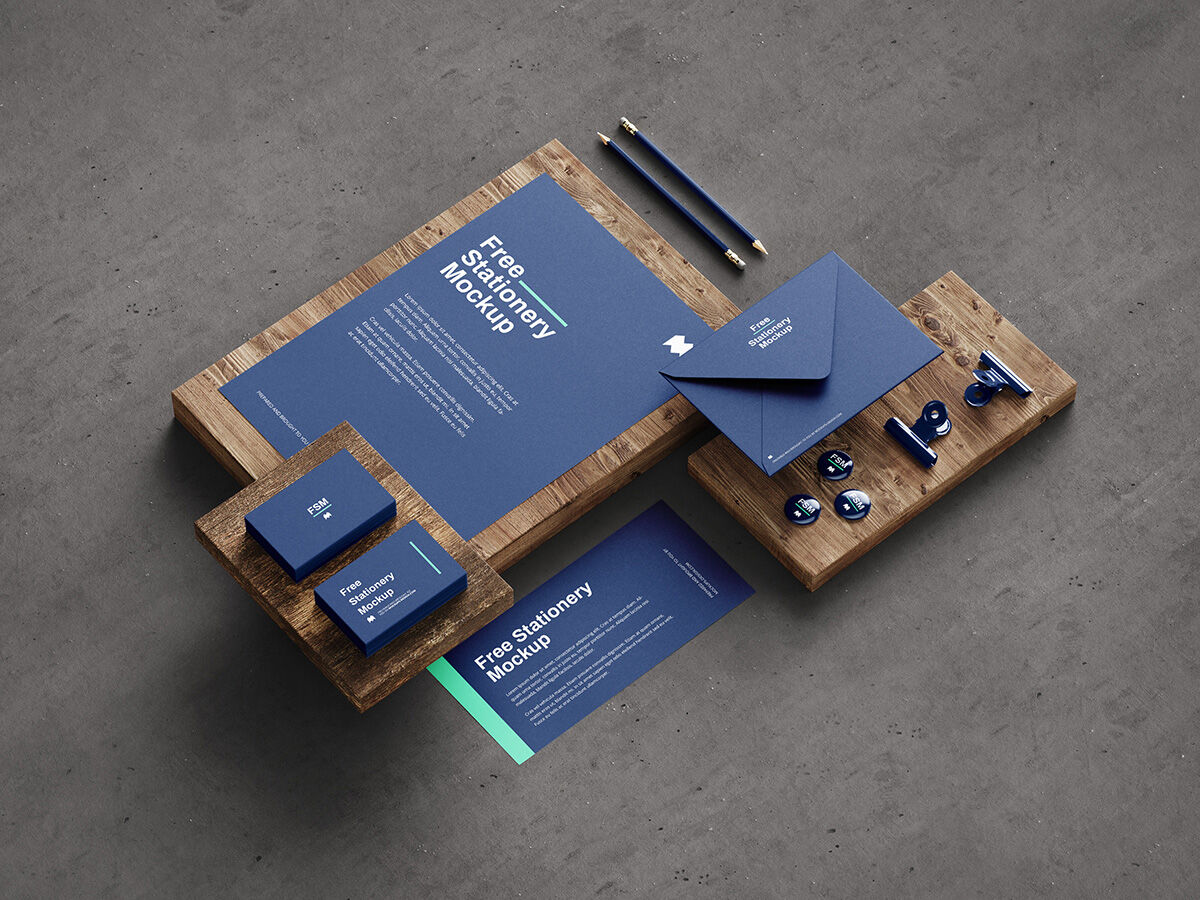 5 Mockups of Stationery in Different Views Featuring Wooden Boards FREE PSD
