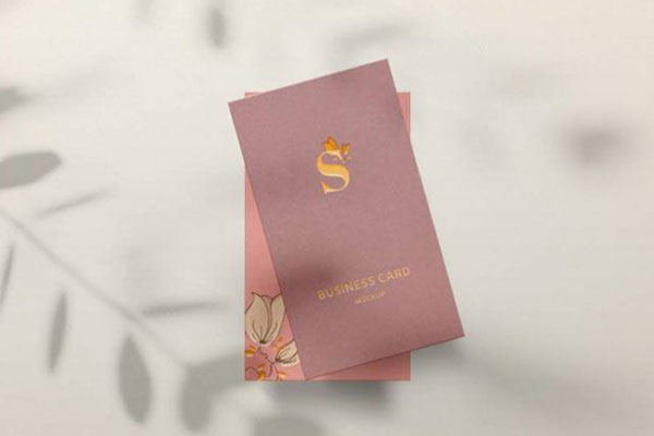 Business Card in Front of a Wall with Leaves Shadow Mockup FREE PSD