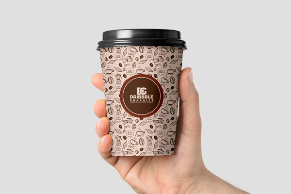 Front View of a Coffee Cup in Man's Hand Mockup FREE PSD