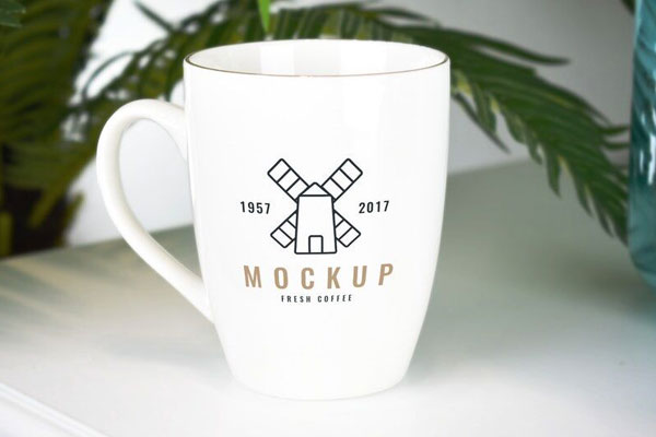 Front View of a Simple Mug With Blur Background Mockup FREE PSD