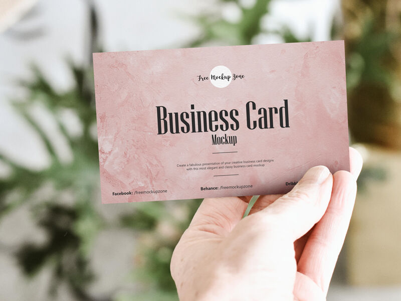 Front View of Man's Hand Showing a Business Card Mockup FREE PSD