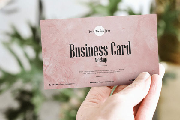 Front View of Man's Hand Showing a Business Card Mockup FREE PSD