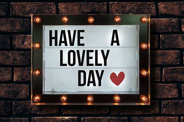 Front View of Marquee Cinema Lightbox on Brick Wall Mockup FREE PSD