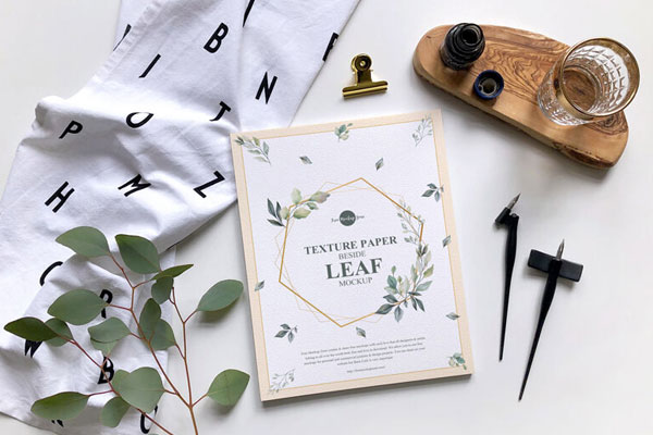 Mockup Featuring a Top View Texture Paper, Glass and Leaf FREE PSD