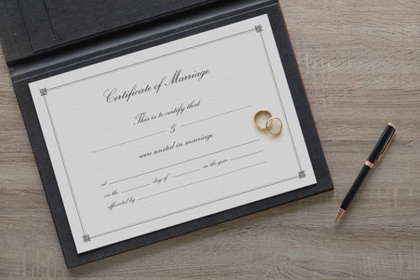 Mockup of Marriage Certificate with Rings and Pen FREE PSD