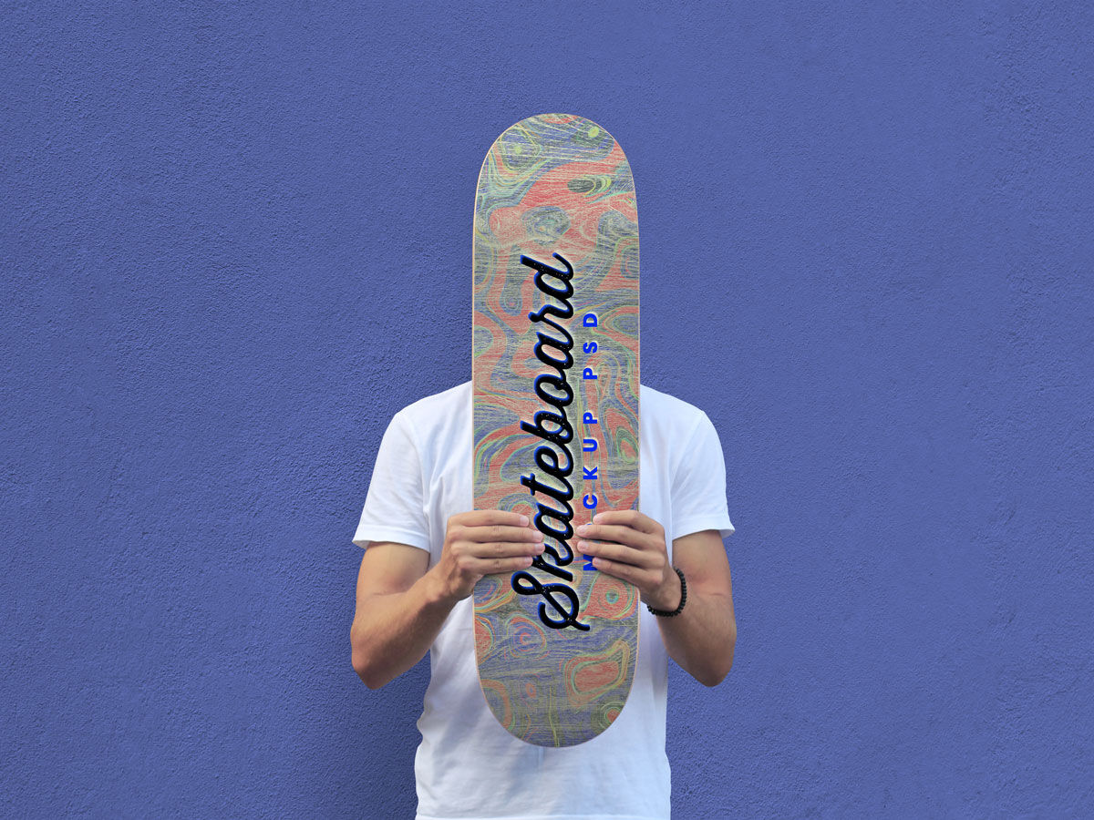 Mockup Showcasing Man Holding Skateboard in Front of His Face FREE PSD