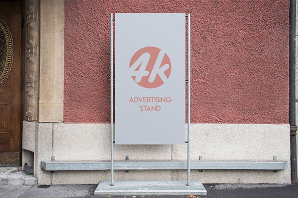Outdoor Advertising Stand next to a Wall Mockup FREE PSD