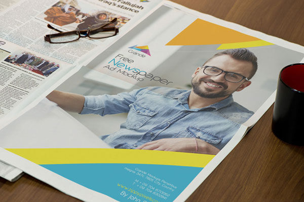 Perspective View Full Page Newspaper Ad Mockup with Glasses FREE PSD