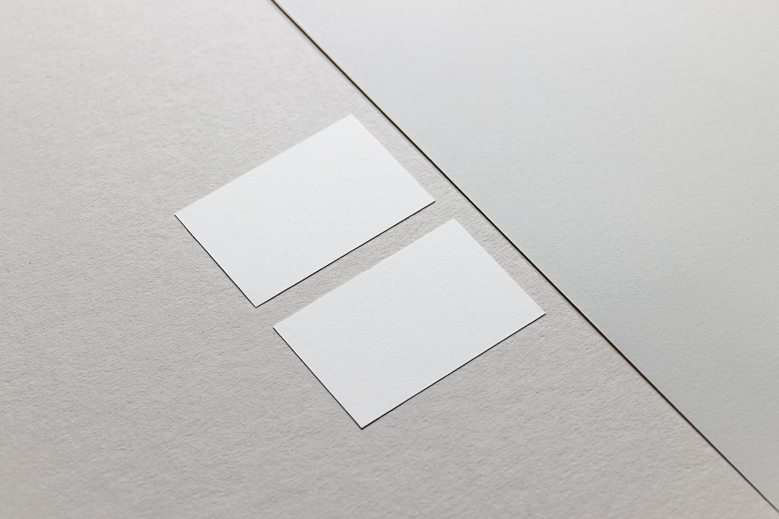 Perspective View of 2 Horizontal Business Cards on Paper Mockup FREE PSD