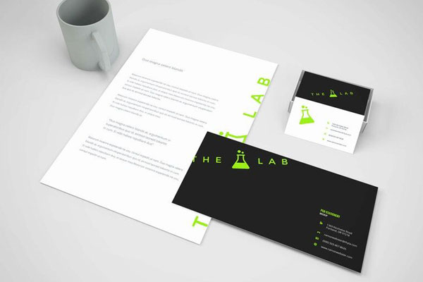Perspective View of Branding Stationery Next to a Mug Mockup FREE PSD
