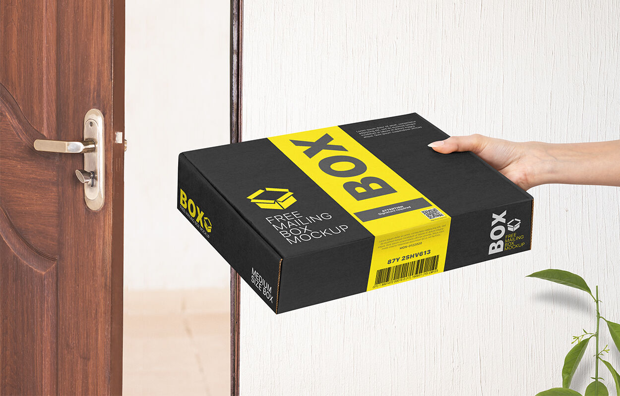 Perspective View of Hand Holding Mailing Box Mockup FREE PSD
