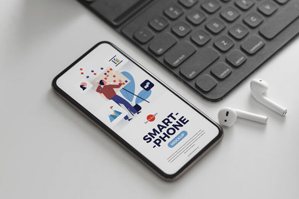 Perspective View Smartphone Mockup with Ear Pods and Black Keyboard FREE PSD