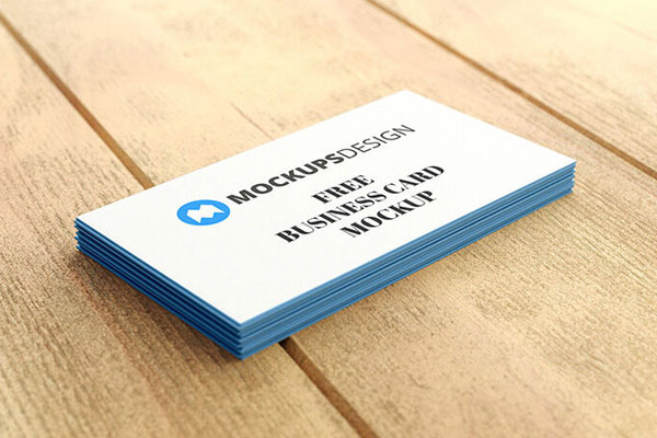 Stack of Professional Business Cards on a Wooden Surface Mockup FREE PSD