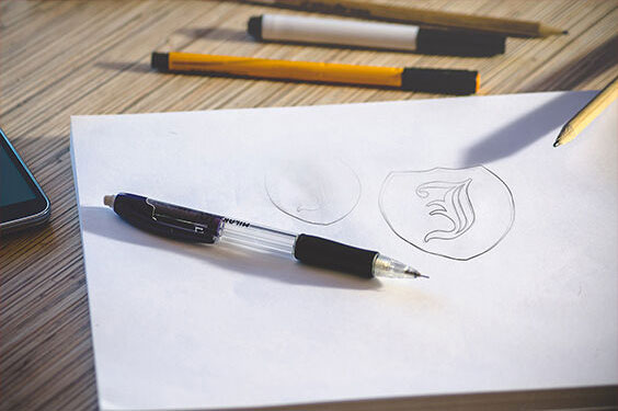 Two Logo Sketch on White Paper Mockups FREE PSD