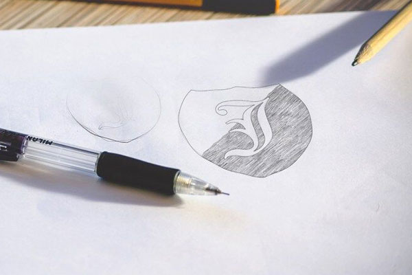 Two Logo Sketch on White Paper Mockups FREE PSD