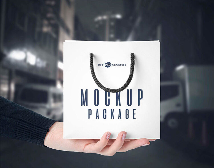 3 Front-View Mockups of a Square Paper Bag in Hand FREE PSD