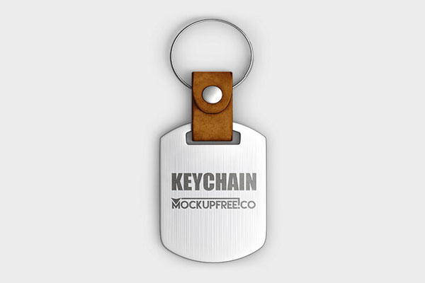 3 Mockups of Keychains Laid on the Surface in Different Views FREE PSD
