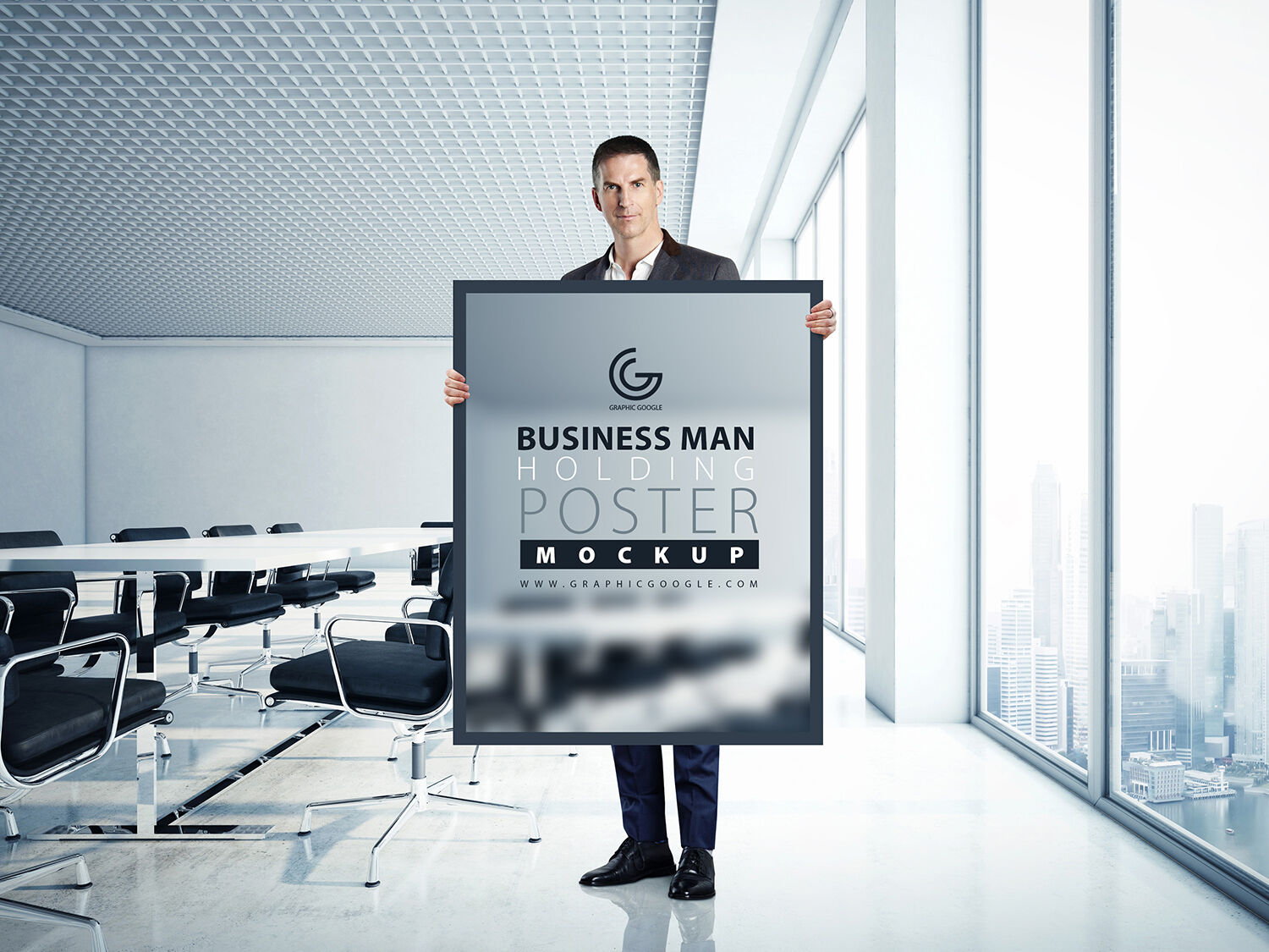 A Man Holding a Poster in an Office Mockup FREE PSD