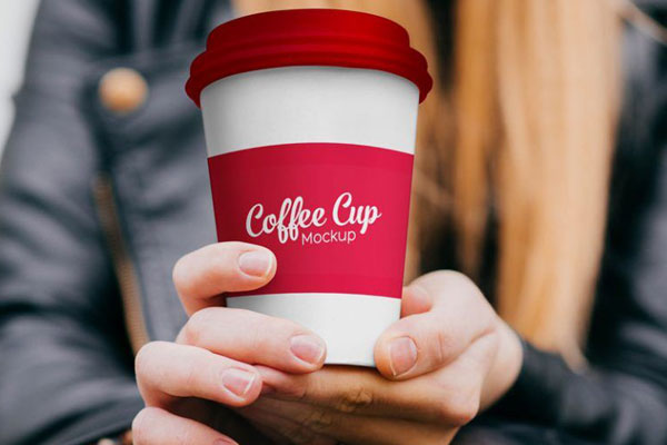 Front View Girl Holding Paper Coffee Cup in Hand Mockup FREE PSD