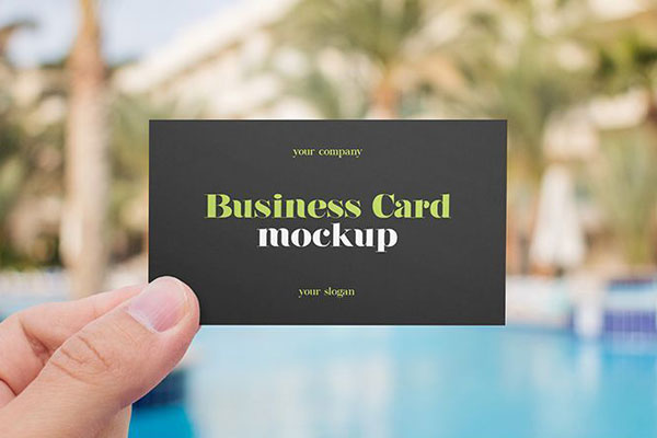 Front View of 2 Business Card Mockups Being Held Up by a Hand FREE PSD