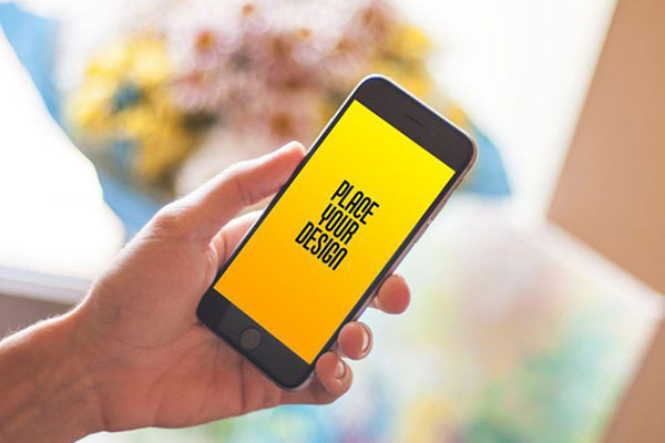 iPhone in Hand in the Perspective View Mockup FREE PSD