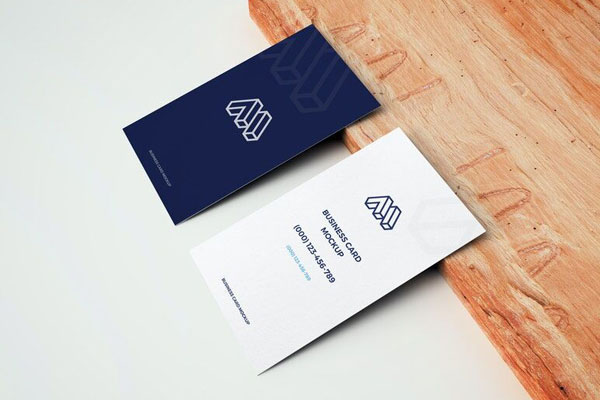 Mockup of Two Business Cards Leaning on Wooden Board in Perspective FREE PSD