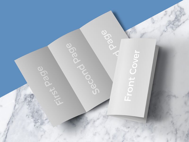 Open and Closed Tri-Fold Brochure on a Marble Surface Mockup FREE PSD