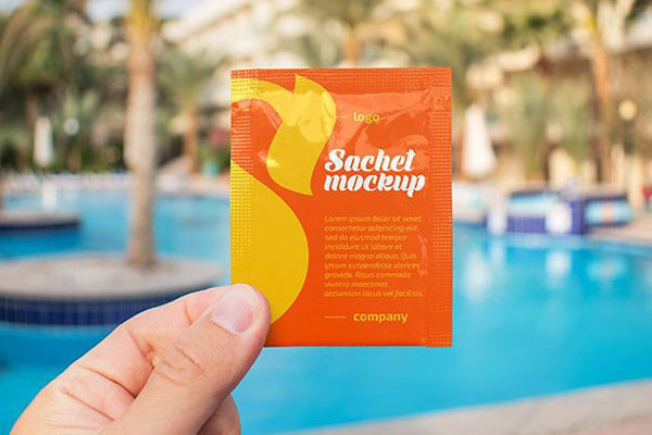 Outdoor Sachet in a Hand Mockup FREE PSD