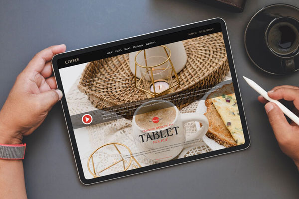 Overhead View of Hand Holding a Tablet and Electronic Pen Mockup FREE PSD