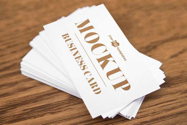 Top View of a Business Card on a Pile Mockup FREE PSD