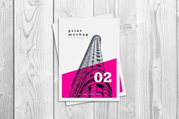 Top View of a Flyer/Poster on a Wooden Table Mockup FREE PSD