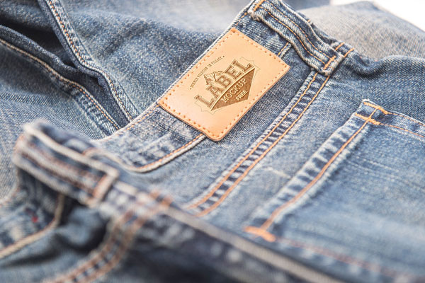 Two Mockups Showing Close-up View of Two Clothing Labels FREE PSD