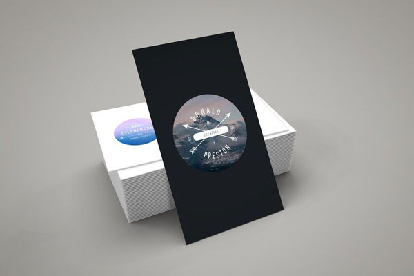 Vertical Business Card Leaning against Stack of Horizontal Cards Mockup FREE PSD