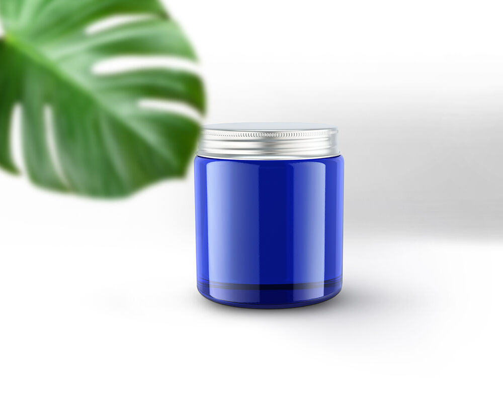 Vertical Candle Jar and Lid Mockup with a Large Leaf FREE PSD