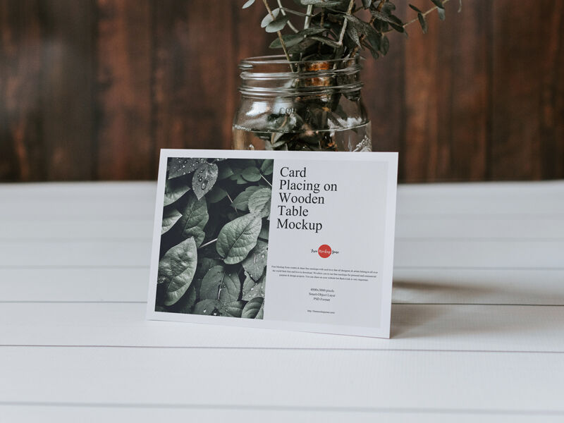Card Placing On Wooden Table Leaning to a Jar Mockup FREE PSD