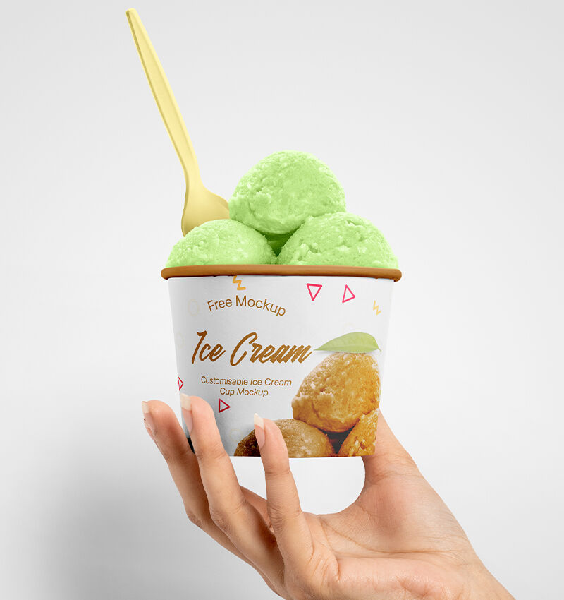 Front View of an Ice Cream Cup Held Up by a Hand Mockup FREE PSD