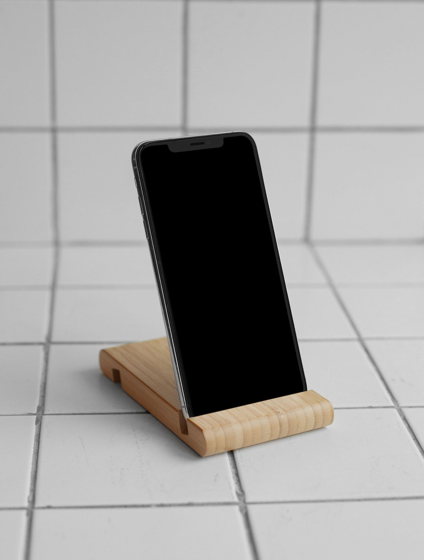 iPhone on Wooden Stand Mockup with Tiled Floor and Wall FREE PSD