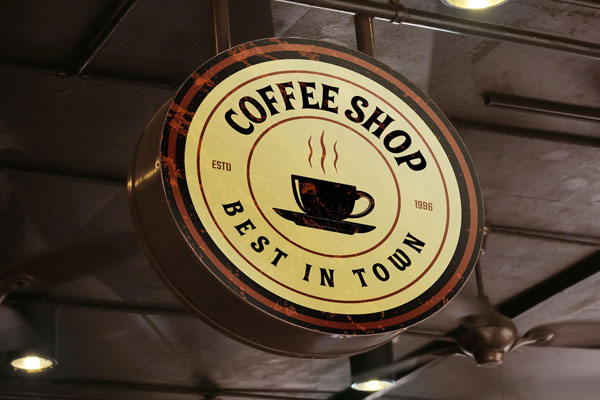 Low Angle View Rustic Round Café Signboard Mockup FREE PSD