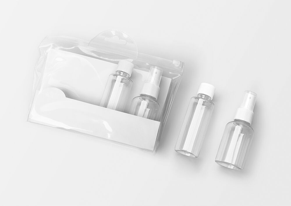 Perspective View Cosmetic Travel Bottles Kit on Floor Mockup FREE PSD