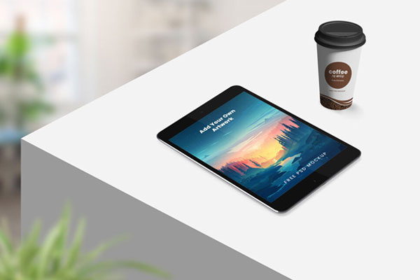 Perspective View Tablet on Table with Coffee Mug Mockup FREE PSD
