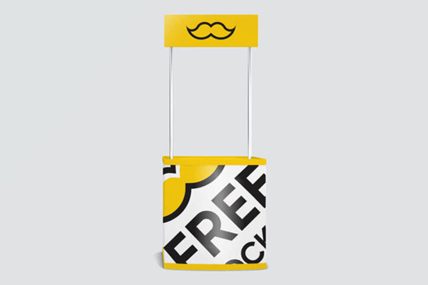 Trade Show Counter Standing in the Front View Mockup FREE PSD