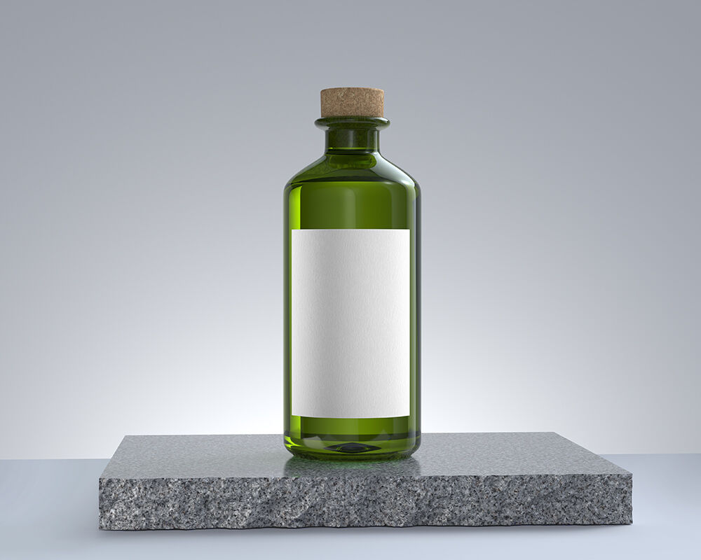 Vertical Clear Oil Glass Bottle on a Rock Mockup FREE PSD