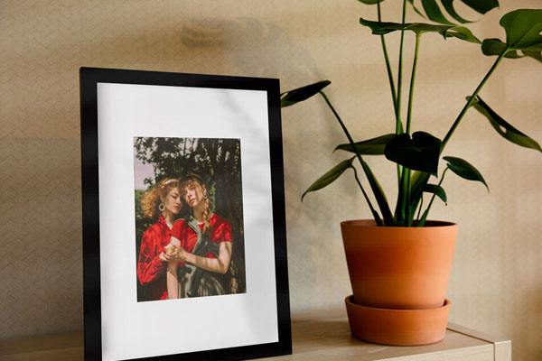 Vertical Photo Frame on a Shelf in the Half-Side View Mockup FREE PSD