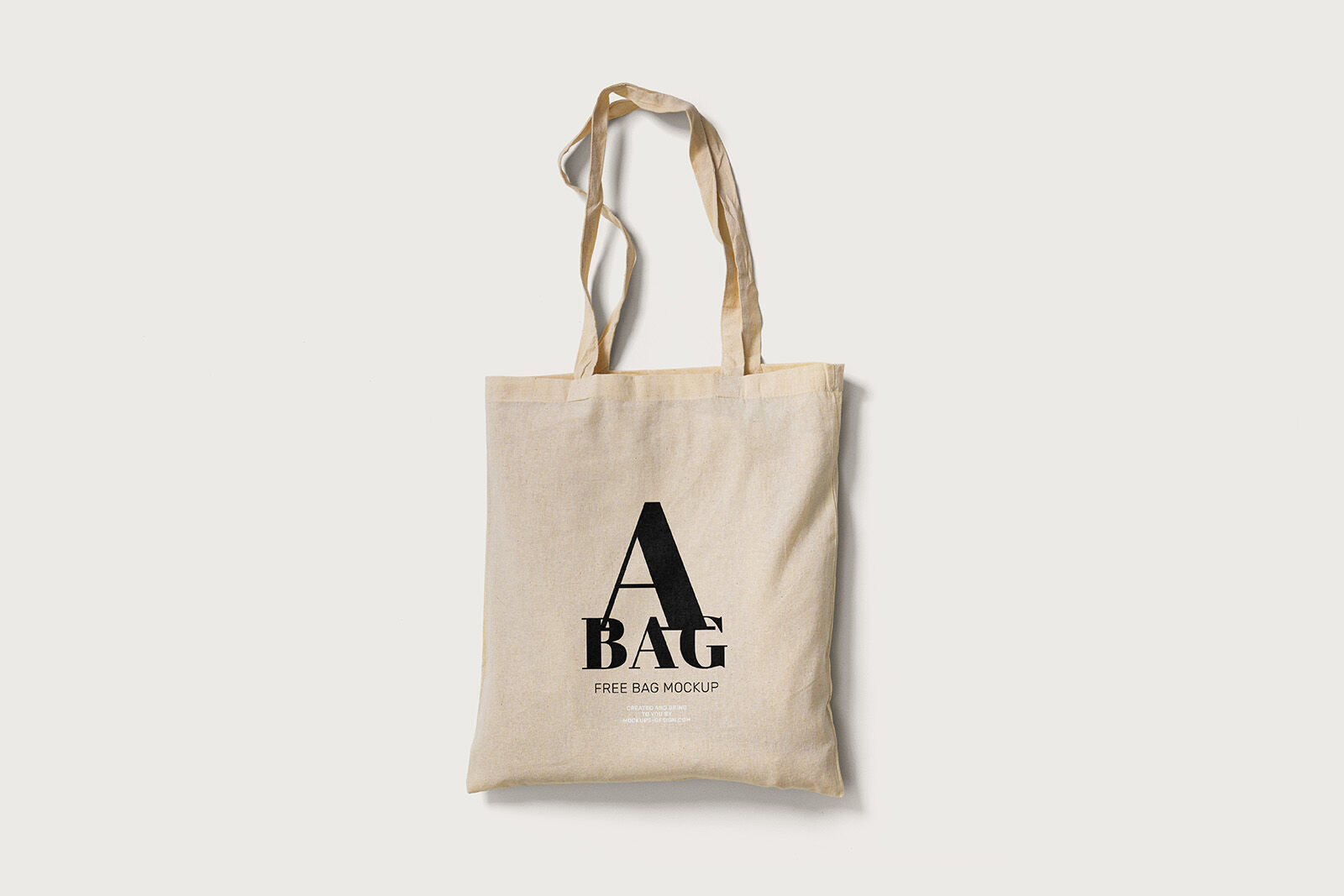 2 Mockups of Tote Bag Laid in Top and Perspective Views FREE PSD